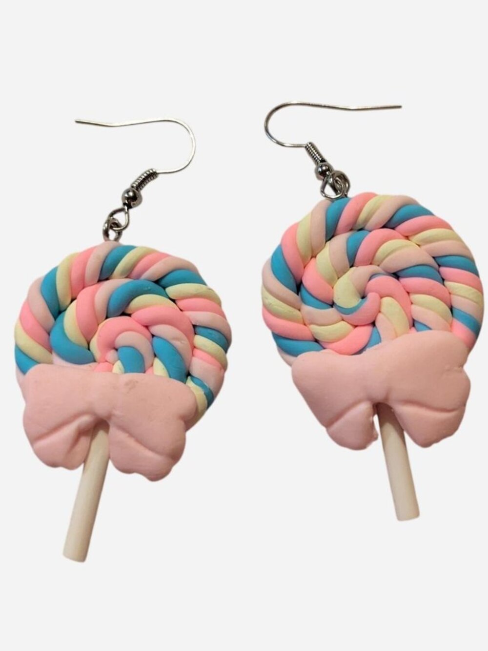 Handmade lollipop earrings with pink, blue, and cream swirls and pink bow